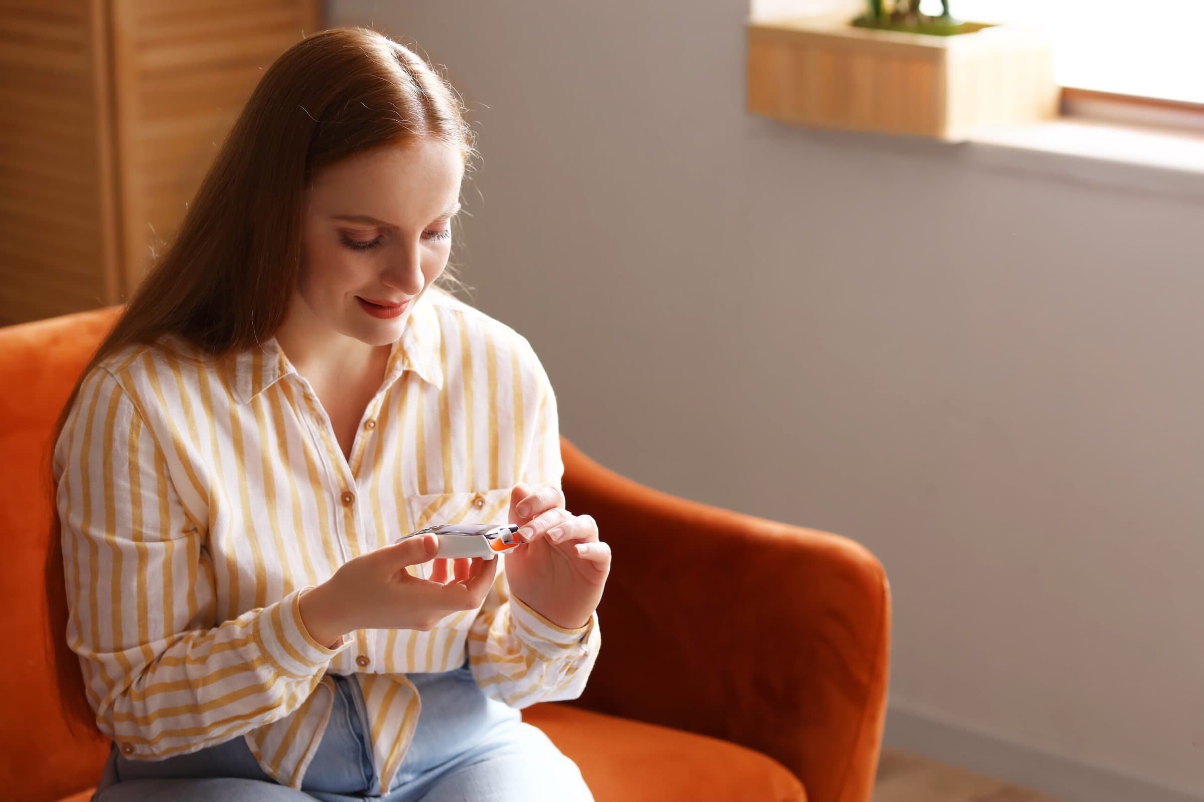 Woman,With,Diabetes,Measuring,Blood,Sugar,Level,At,Home