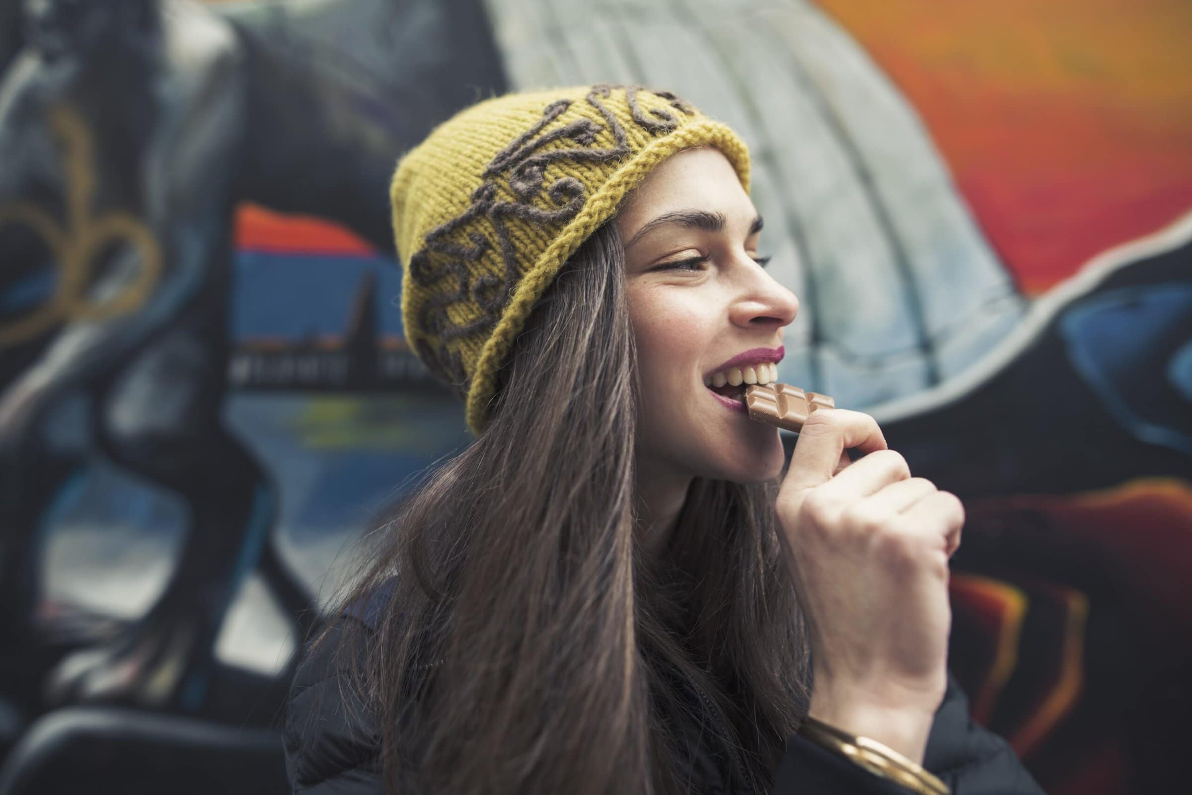 Candid,Image,Of,A,Beautiful,Young,Woman,Biting,A,Chocolate
